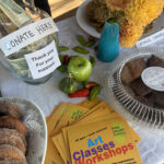 Refreshment Break fundraiser - Baked goods and River Gallery School marketing collateral on a table